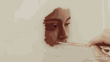a drawing of a woman 's face is being made in animotica
