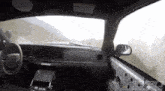 the inside of a police car with a warning sign on the visor