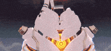a white robot is flying through the air with a target on it 's chest