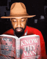 a man reading a book titled know thy man