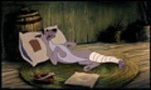 a cartoon character with a bandaged leg is laying on a rug .