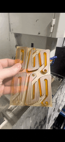 a person is holding a piece of metal that says ' i love you '