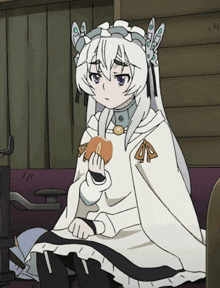 a girl with white hair is holding a sandwich
