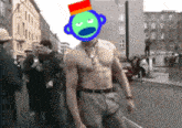 a shirtless man with a colorful face on his head