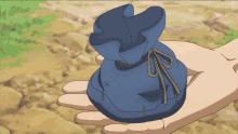 a person is holding a blue bag in their hand while a screen says funimation