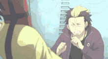 a man in a purple jacket is fighting another man in a yellow shirt .