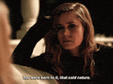 a close up of a woman 's face with the words " you were born to it that cold nature "