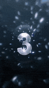 the number three is on a dark background with a light coming out of it .
