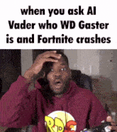 a man in a red hoodie is holding a playstation controller and making a surprised face .