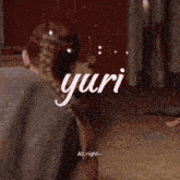 a man in a black tank top with the word yuri on the bottom