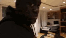 a blurry picture of a man standing in a room