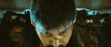 a close up of a man 's face with blood coming out of his nose