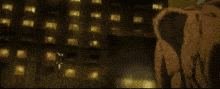 a man is standing on the roof of a building holding a sword .