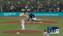 a baseball game is being played in front of an ad for westjet
