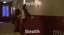 a man in a red suit is dancing in a hallway with the words payday 2 stealth written on the bottom