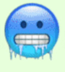 a blue smiley face with ice coming out of it 's mouth and teeth .