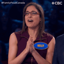 a woman with a name tag that says nelly on it