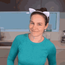 a woman wearing a headband with white cat ears