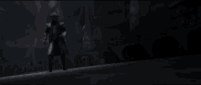 a man is standing in a dark room with a sword in his hand