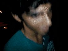 a blurry picture of a man with a tattoo on his arm that says " i love you "