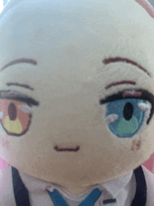 a close up of a stuffed animal with a blue tie