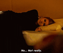 a woman laying on a bed with the words " no ... not really " next to her