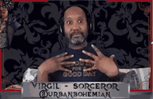 a man wearing headphones stands in front of a sign that says virgil sorceror