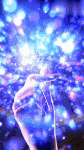 a hand is holding a string in front of a purple background