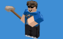 a man in a blue shirt is holding a wooden hammer