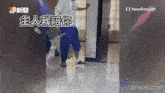 a man standing in front of a door with chinese characters on it