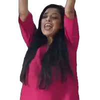 a woman in a pink shirt holds her arms in the air