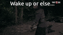 a man holding an axe in a forest with the words wake up or else