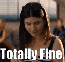 a woman is wearing sunglasses and the words totally fine are below her