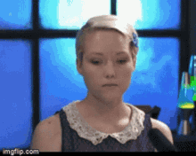 a woman speaking into a microphone with imgflip.com at the bottom right