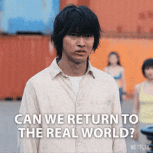 a man in a white shirt with the words can we return to the real world on the bottom
