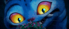 a close up of a blue cartoon cat with yellow eyes