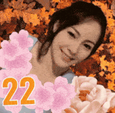 a picture of a woman with flowers and the number 22 on it