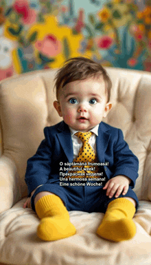 a baby in a suit and tie sits in a chair