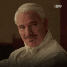 a man with white hair and a mustache asks if he still loves him
