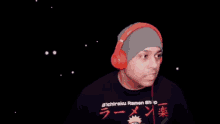 a man wearing headphones and a shirt that says " ichiraku ramen shop "