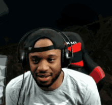 a man wearing headphones and a hat that says rkc