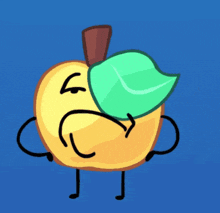 a yellow apple with a green leaf on it