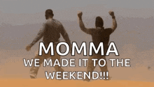 a man and woman are jumping in the air with their arms in the air .