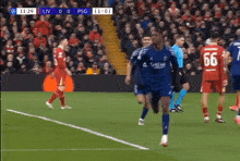 a soccer player with the number 66 on his back is running on the field