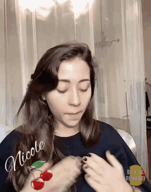 a woman with the name nicole written on her face