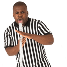 a man in a black and white striped shirt throws up