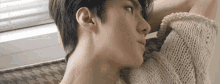 a close up of a person 's neck and shoulder .