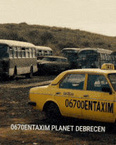 a yellow skoda taxi is parked in a lot