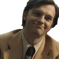 a man in a suit and tie is smiling with a white background