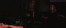 two men are dancing in a dark room and the words trippy lights and rave music are above them